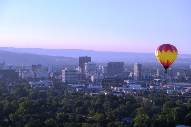 Aerial view of Boise with a hot air balloon, representing choosing the right Boise neighborhood