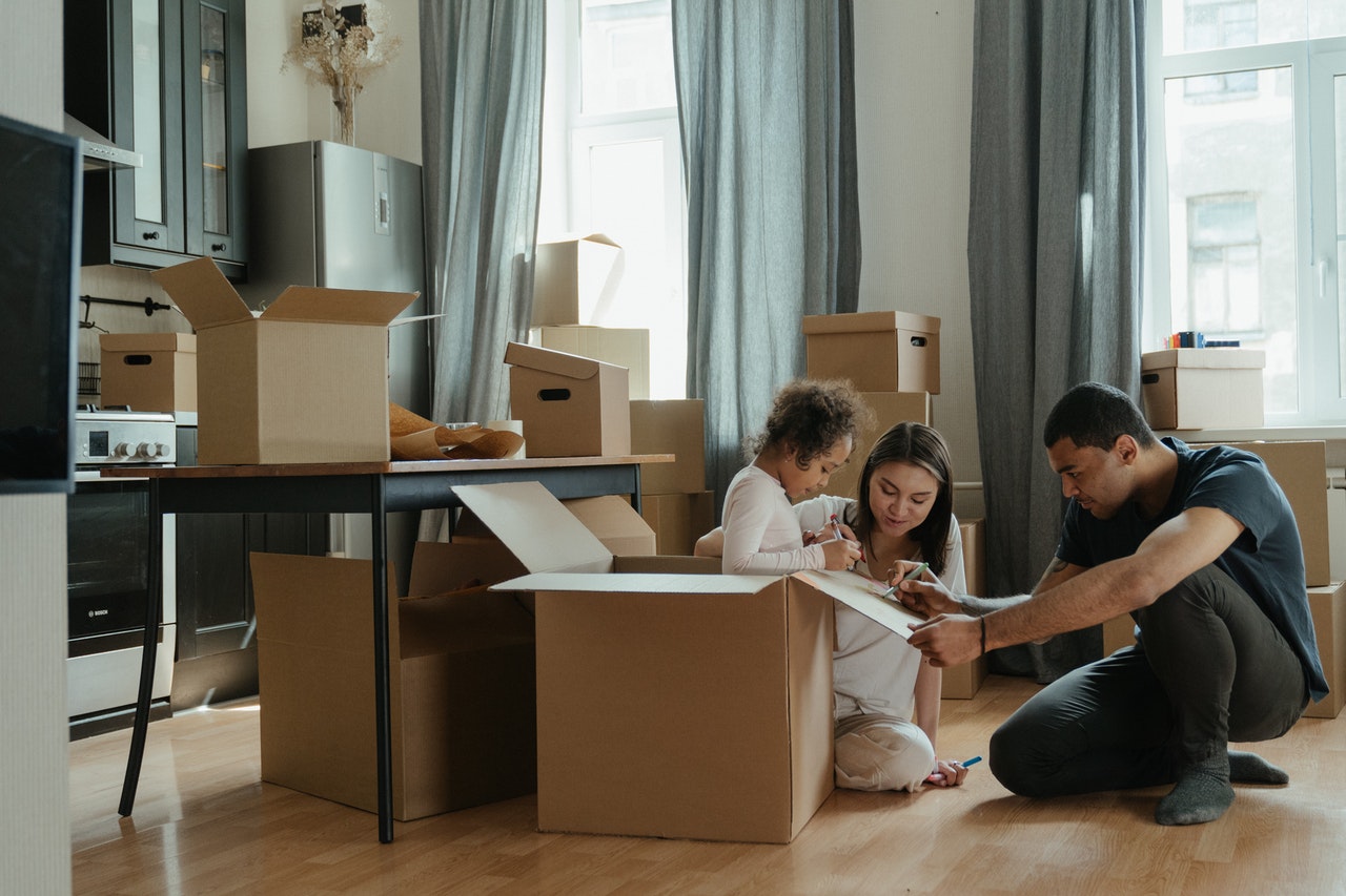 A family unpacking in their new home